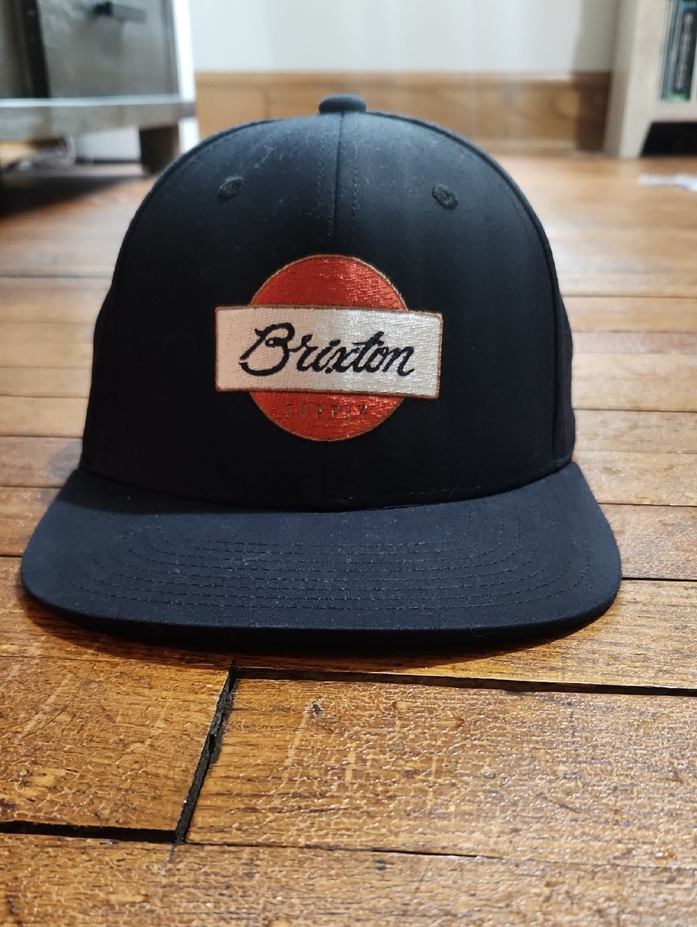 Brixton Black Cap with Red and Cream Logo Patch